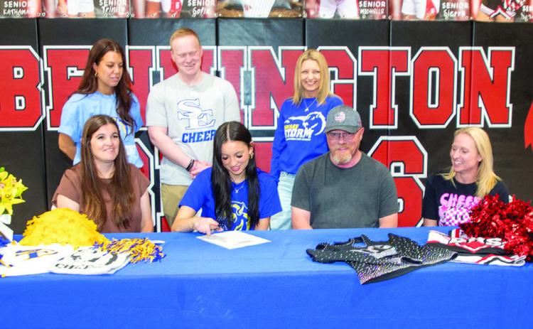 Bennington High School senior Soraya Smith signed last week to cheer for Southeastern Oklahoma State University. Also shown are, Hunter Smith, brother; Rachel Smith, mother; Keith Smith, father; Jennifer Moore, Bennington cheer coach; Kaceston Smith, brother; Kailea Marshall, SE cheer coach; Nate Clark, North Texas Cheer coach, and Robbi Simpson, North Texas Cheer owner. Matt Swearengin | Durant Democrat