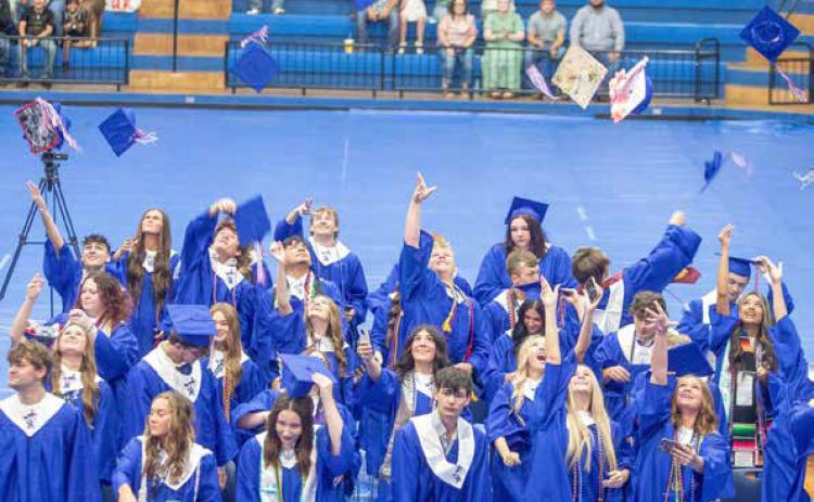 Silo High School class of 2026 graduates celebrate at the end of graduation on Saturday at Bloomer Sullivan Arena.