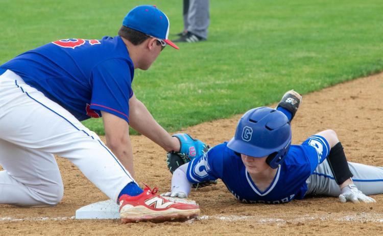 Durant Lion Maddox Arnold tries to tag a Glenpool player. Matt Swearengin | Durant Democrat