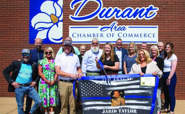A ribbon cutting was held last week at the Durant Area Chamber of Commerce o_ce for the Jarid Taylor Memorial 5K and Fun Run. Taylor was a Bryan County Sheri’s deputy who gave his life in the line of duty in 2020. Matt Swearengin | Durant Democrat