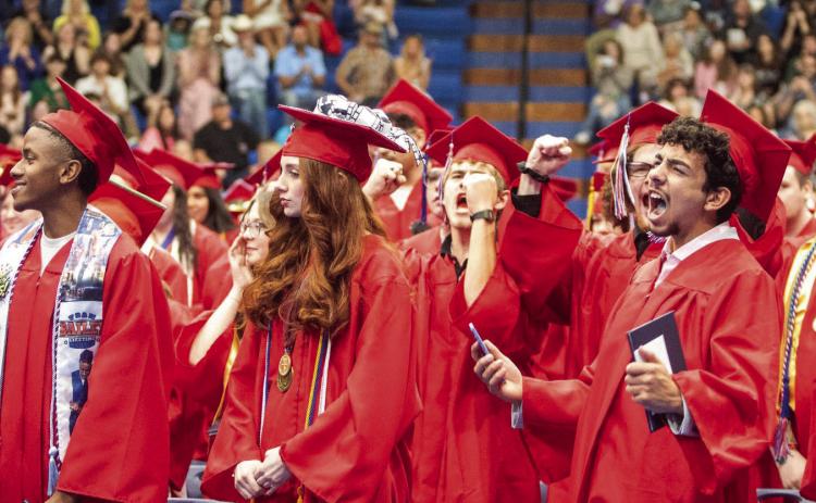 Members of the Durant High School Class of 2025 celebrate at the end of commencement on May 22 at Bloomer Sullivan Arena.