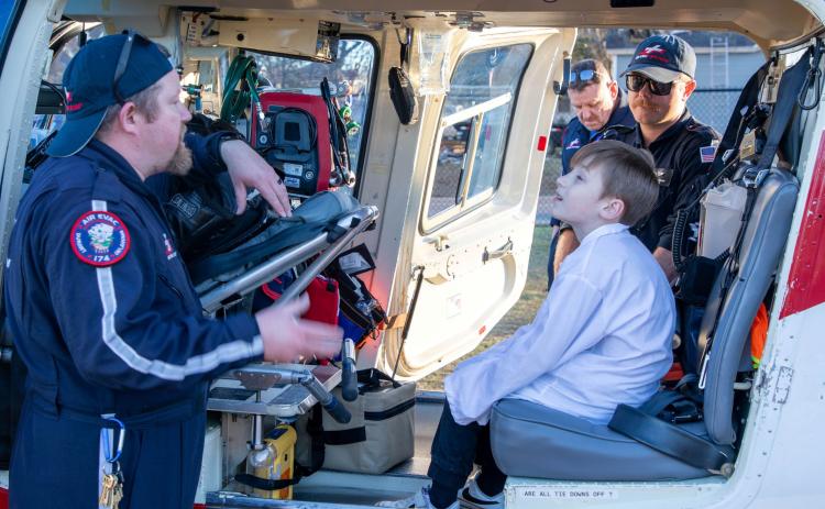 Washington Irving Elementary School had its STEM and Science Fair Feb. 27. Children were able to sit in the Air Evac Lifeteam helicopter after it landed on the playground. Matt Swearengin | Durant Democrat