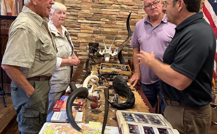 Larry and Phyllis Elrod show African treasures to Martin Vanmeter and Kevin Dale. Photos provided
