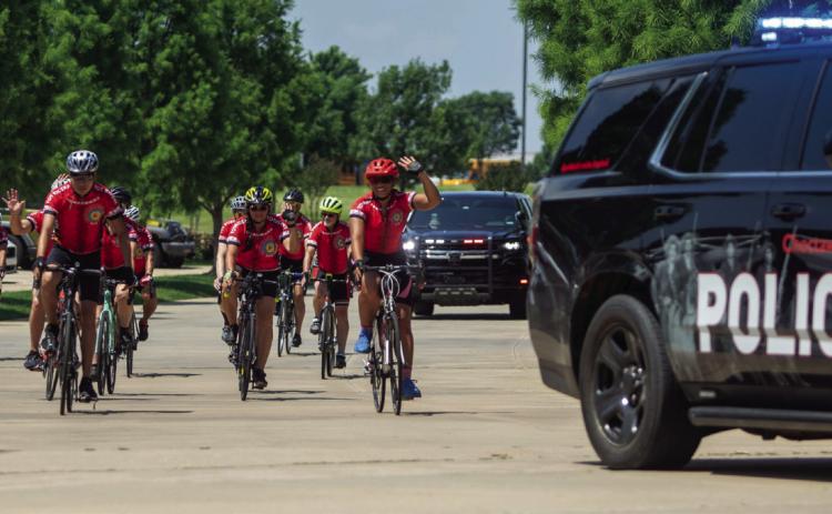 Choctaw Lighthorse Police escort the Trail of Tears Bike Team to the tribe’s headquarters after the cyclists completed a 500 mile ride from Mississippi to Oklahoma in honor of tribal ancestors who walked the Trail of Tears.