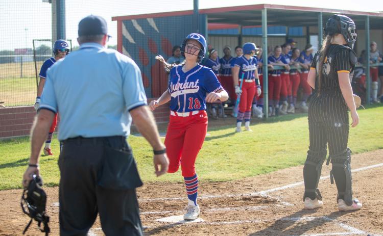 Lady Lion Paisley Henson lands on home plate in the game with Madill. Matt Swearengin | Durant Democrat