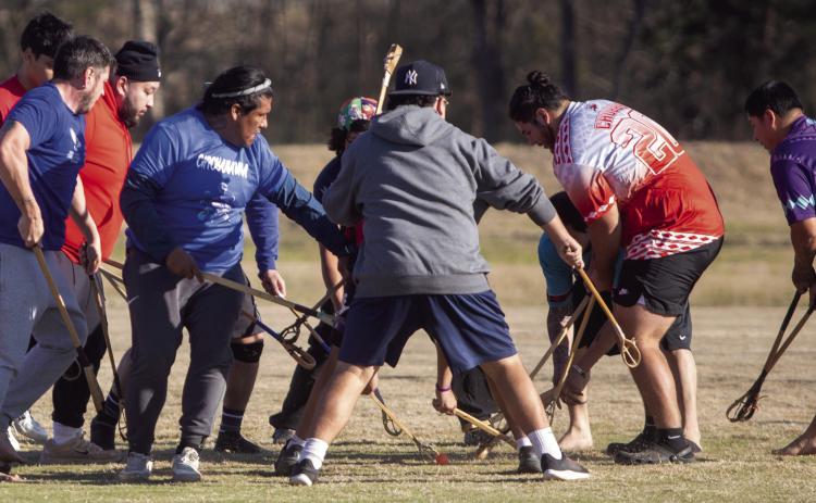 Players face each other during the Choctaw stickball exhibition last Saturday at the Choctaw Cultural Center.