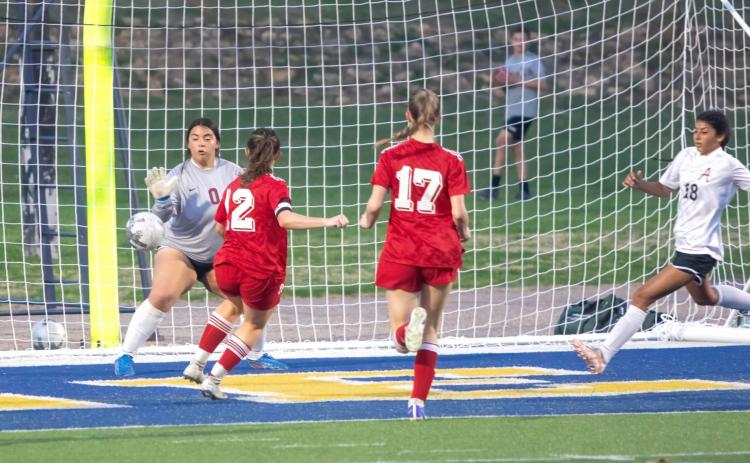The Durant Lady Lions score in last week’s game with Ardmore. From left, Karah Boydstun, J.J. Patten and Katelyn Ortiz. Matt Swearengin | Durant Democrat