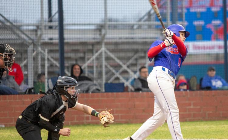 Lion Lucas McClure hits the ball. Matt Swearengin | Durant Democrat