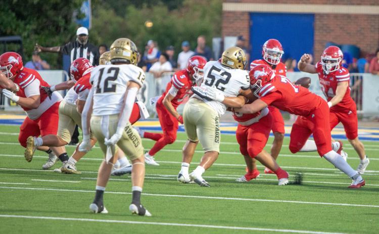 Durant Lions tangle with Broken Bow Savages during a recent game. Matt Swearengin | Durant Democrat