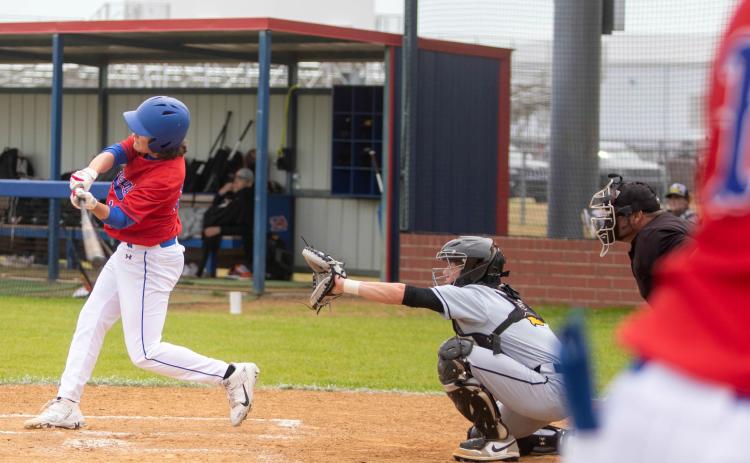 Lion Lucas McClure swings at the ball. Matt Swearengin | Durant Democrat
