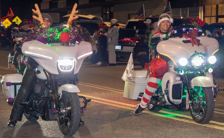 Motorcyclists ride in the Durant Christmas Parade.