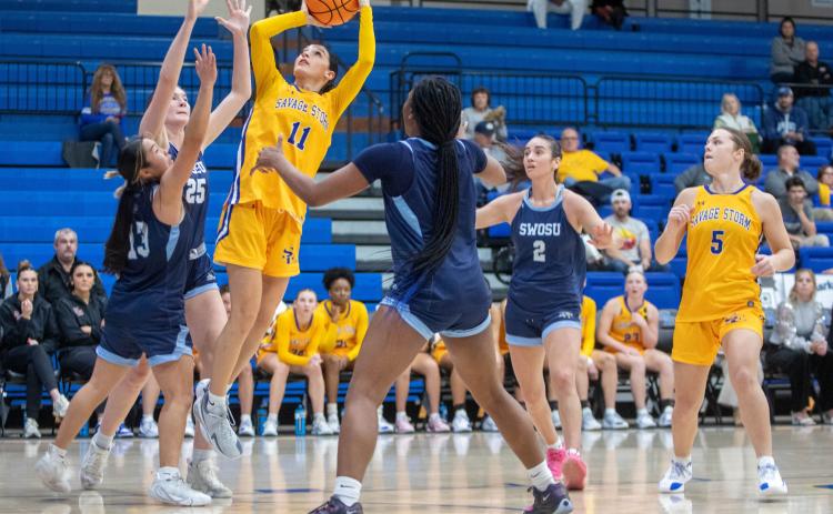 Southeastern basketball players Kenzli Warden and Brenna Howard face Southwestern players. Matt Swearengin | Durant Democrat