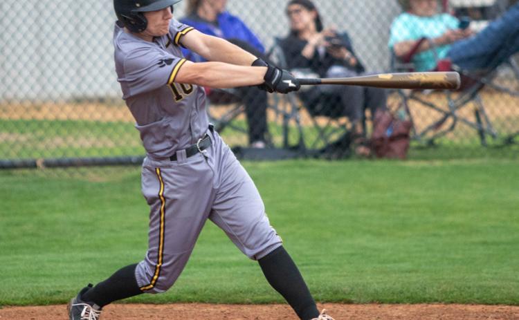 Calera Bulldog Logan Bumgarner swings at the ball during the conference championship with Caddo. Matt Swearengin | Durant Democrat
