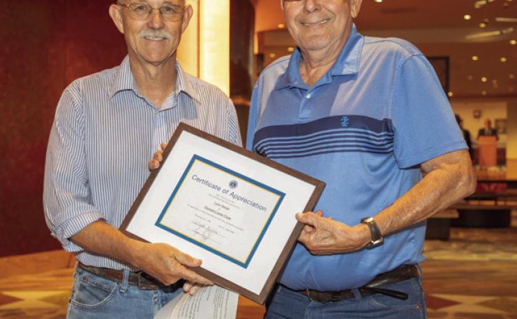 Durant Lion’s Club member Lynn Smith, right, received a certificate of achievement at the club’s annual banquet at the Choctaw Cultural Center. Also shown is Lion President Layne Heitz.