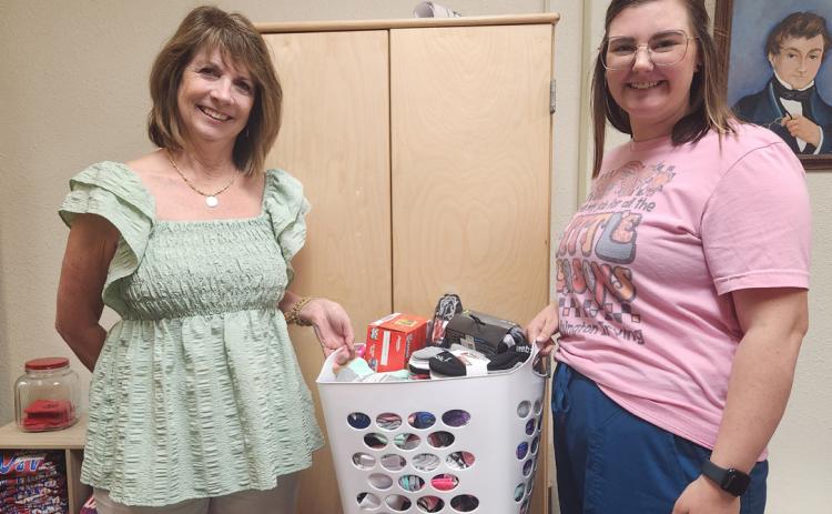 Photo provided | WI Quick Lane Fellowship recently donated clothes and snacks for Washington Irving students. Pictured with WI nurse, Zoey Shelton, is QLF member and former WI teacher, Patty Dixon. WI teachers and staff would like to say a big thank you for the generous donation.
