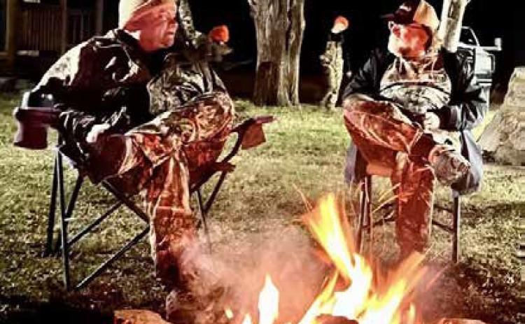 Donnie Wooley makes a point to Mark Swearengin during a recent deer camp. Photo provided