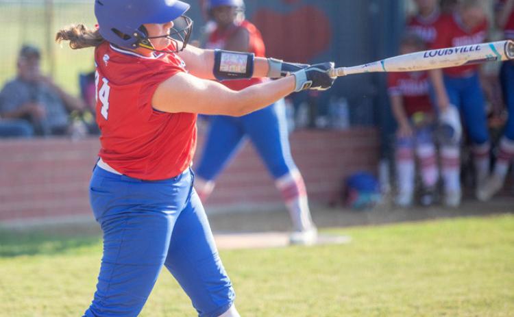 Durant Lady Lion Emma Sherrer swings at the ball. Matt Swearengin | Durant Democrat