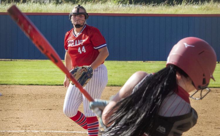 An Ardmore batter swings the bat after Durant Lady Lion pitcher Emma Sherrer fired the ball. Matt Swearengin | Durant Democrat