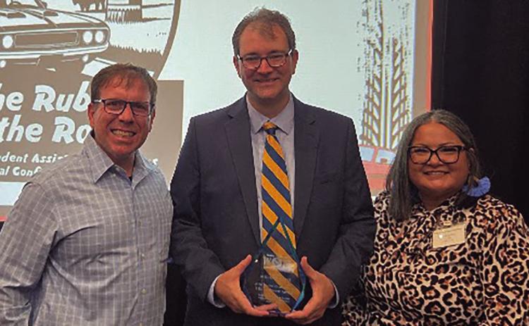 Dr. Mike Davis, associate professor of criminal justice and special assistant to the President for compliance at Southeastern Oklahoma State University was honored by the Oklahoma Division of Student Assistance as the recipient of the Walter O. Mason TRIO Achiever Award. From left, Corey Hammel, Upward Bound coordinator; Davis, and Teriki Barnes, Upward Bound Director at SE. Photo provided