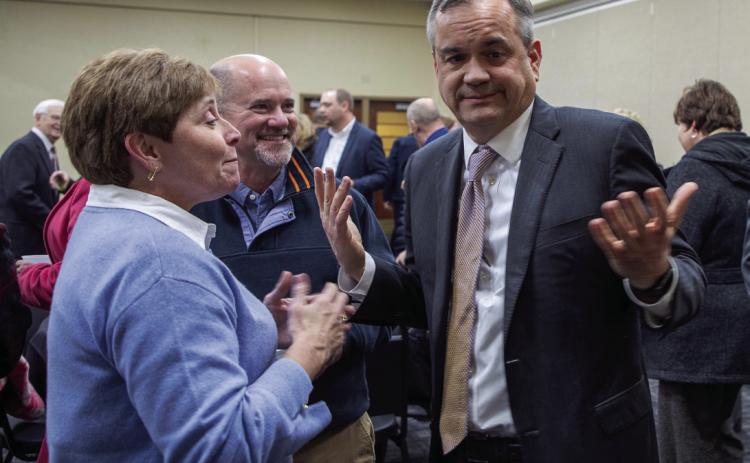 Matt Swearengin | Durant Democrat Oklahoma State Regents for Higher Education Chancellor Sean Burrage talks to Liz McCraw, vice president of student a_airs, during a reception for Burrage last week.