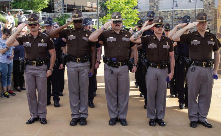 Oklahoma Highway Patrol Troopers salute during the Law Enforcement Memorial Tribute May 14 at the Choctaw Amphitheater. Matt Swearengin | Durant Democrat