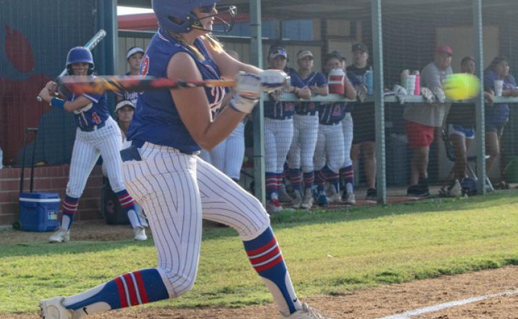 Lady Lion Korbyn Robinson is about to hit the ball. Matt Swearengin | Durant Democrat