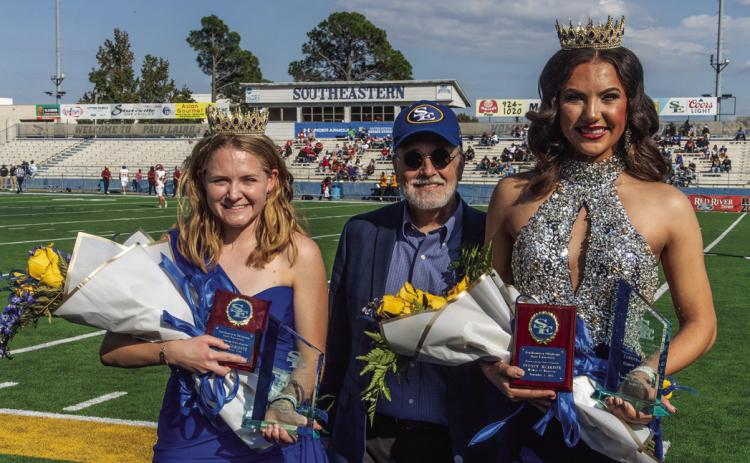 Sarah Coblentz, left, and Sydney Reardon were named 2025 Southeastern Homecoming Royalty. In the middle is Southeastern Interim President Dr. David Whitlock. Dan Hoke | SE