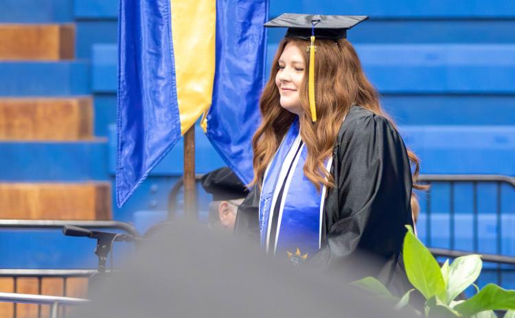 Southeastern graduate Carissa Wright walks to the stage to receive her baccalaureate degree during commencement Dec. 14 at Bloomer Sullivan Arena. Matt Swearengin | Durant Democrat
