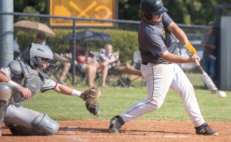 Calera Bulldog Jaron Varner hits the ball. Matt Swearengin | Durant Democrat