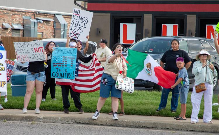 A rally to protest the Trump administration’s policies will be July 17 in Durant. This picture is from a protest last month. Matt Swearengin | Durant Democrat