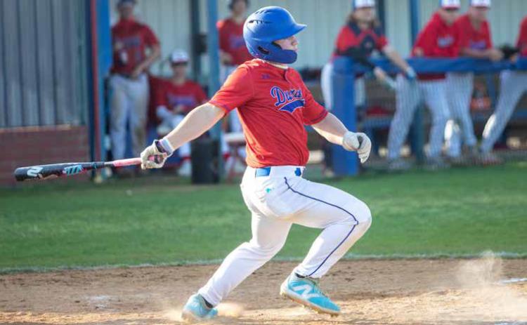 Lion Aiden Diviney swings at the ball during the home game with Tahlequah. Matt Swearengin | Durant Democrat