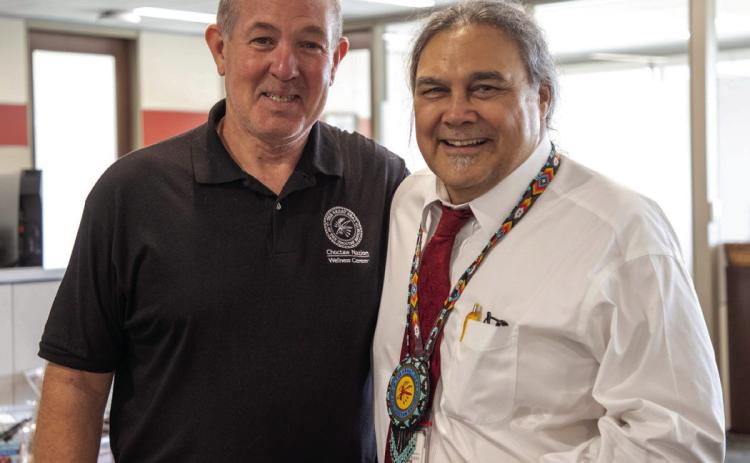 Charles Clark, right, who writes press releases and takes photos for The Choctaw Nation, poses with District 9 Tribal Council Member James Dry. Clark was honored for 10 years of service to the tribe. Matt Swearengin | Durant Democrat