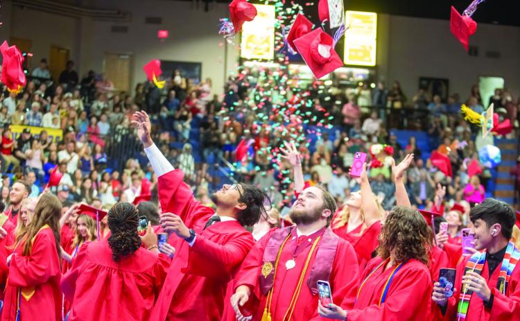 Caps and confetti are thrown at the end of commencement for the Durant High School Class of 2024. The graduation was held May 16 at Southeastern Bloomer Sullivan Arena. Matt Swearengin | Durant Democrat