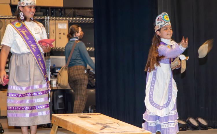 LEFT: Junior Miss Choctaw Nation Daryan Eubanks and Little Miss Choctaw Nation Ava Davenport play cornhole during the fourth anniversary of the Choctaw Cultural Center.
