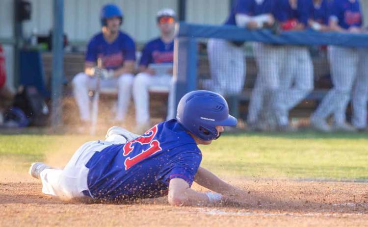 Lion Hayden Winninger lands on home plate. Matt Swearengin | Durant Democrat