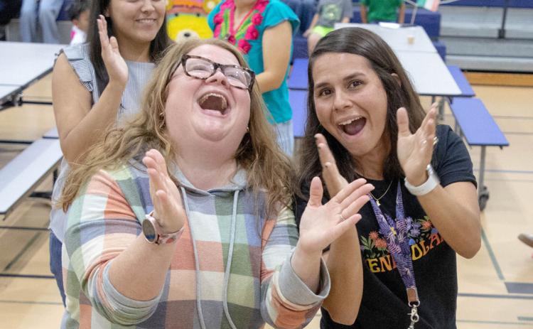 Natalie Cox, left, Washington Irving kindergarten teacher, and Yubelis Williams-Diaz, prevention coordinator, react during the Hispanic Heritage Celebration.