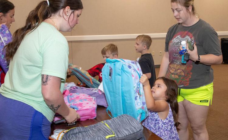 Matt Swearengin | Durant Democrat The Bryan County Turning Point Coalition had its Back to School Bash last Saturday at the library and 423 backpacks with school supplies were given to students.
