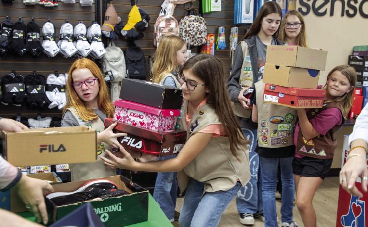 Girls Scouts collect shoes, socks for Durant students
