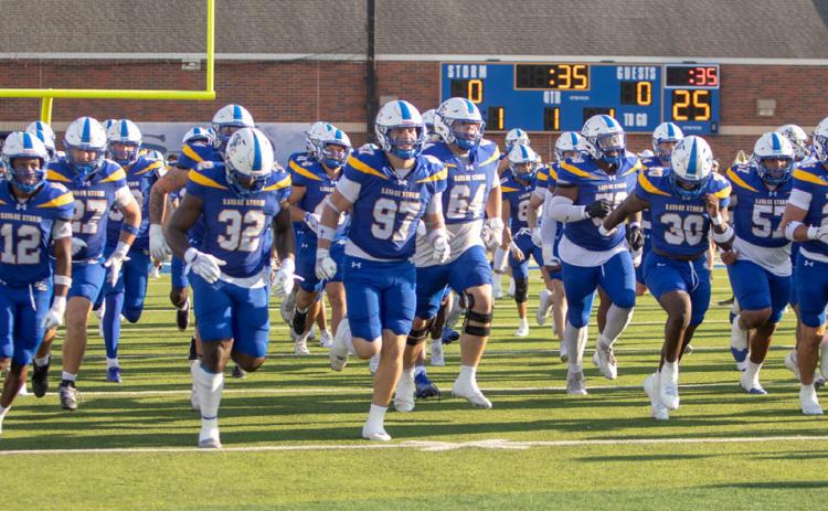 Southeastern Savage Storm football players run onto the field before the start of a home game. Matt Swearengin | Durant Democrat