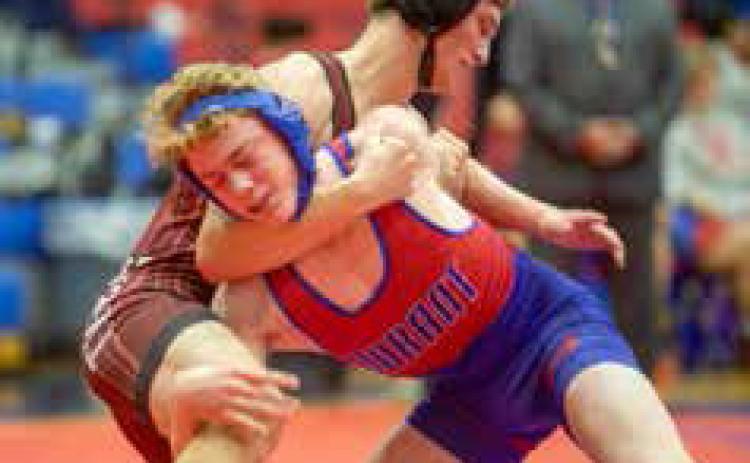 Lion Britton Trotter wrestles during a match last week with an Ardmore wrestler. Matt Swearengin | Durant Democrat