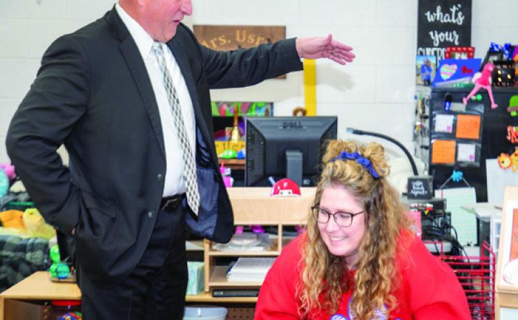 Matt Swearengin | Durant Democrat Durant School District Superintendent Duane Merideth congratulates Robert E. Lee Early Childhood Center teacher Shaunda Usry during a surprise visit last month to her classroom to announce she had been named Durant Teacher of the Year for 2023-2024. In a Monday meeting of the Durant Board of Education, Merideth announced he is retiring e ctive July 1. He has served 40 years in education with 31 of those years being in Durant.