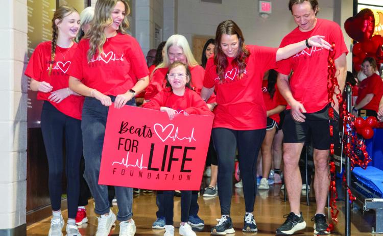 The Beats for Life Foundation Heart Walk was Saturday at Bloomer Sullivan Arena. From left, Baylee Sullivan, Brooklyn Sullivan, Blair Sullivan, Carolyn Holland (in back), Angie Sullivan and Jordan Sullivan. Matt Swearengin | Durant Democrat