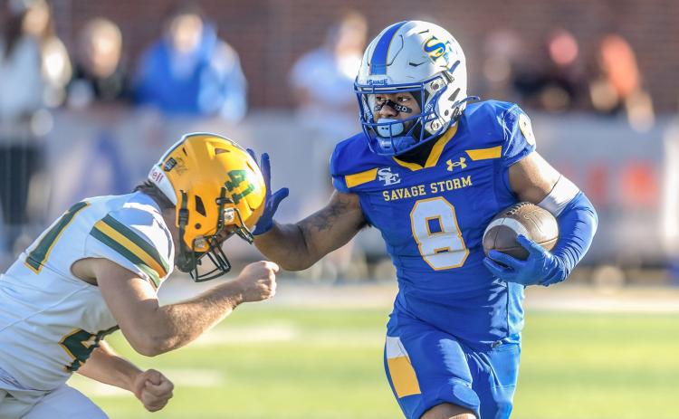 Southeastern football player Andre Williams goes up against an Arkansas Tech player during a recent game. Dan Hoke | SE