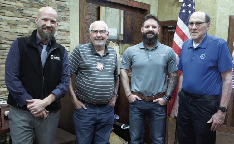 Andreas Weber, third from left, is the Advanced Mobility Coordinator for ODOT and he spoke to the Durant Lions Club last week about the Oklahoma Electric Vehicle Infrastructure Deployment Plan. Also shown from left are, Jeremy Spence, Durant Area Chamber of Commerce Manager, and Lions Club members Lynn Smith and Paul Buntz. Matt Swearengin | Durant Democrat