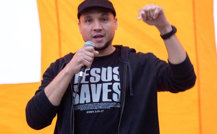 Hearts Transformed Ministries had a campus worship night April 29 at the Southeastern Tailgate Alley. The event included free food and a car giveaway. Shown speaking is Pastor Anderson Reign. Matt Swearengin | Durant Democrat