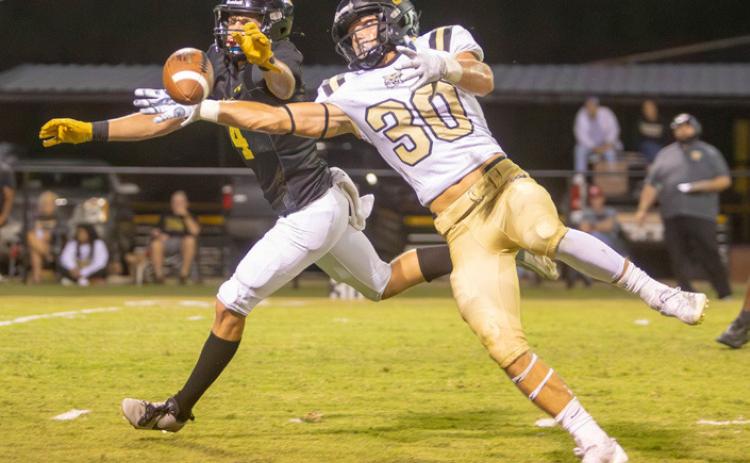 Caddo Bruin Jake Green and Seiling player Jazin Baker reach for the ball. Matt Swearengin | Durant Democrat