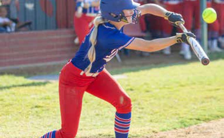Durant softball player Harper Plymale bunts the ball. Matt Swearengin | Durant Democrat