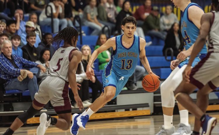 SE basketball player Santiago Camacho Gomez dribbles the ball in last Saturday’s season home opener with Dallas Christian at Bloomer Sullivan Arena. Dan Hoke | SE