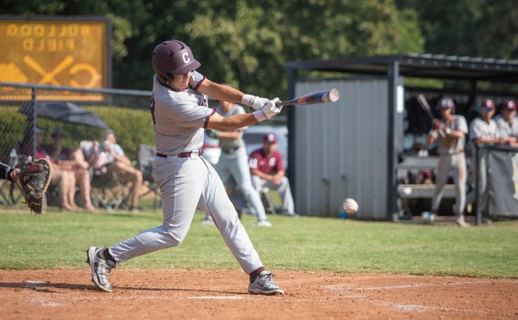 Matt Swearengin | Durant Democrat Colbert Leopard Eric Hokett swings at the ball during the game with Calera.