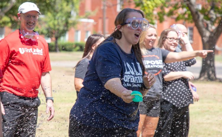 First United Bank held its recent water balloon event to raise money for school supplies.